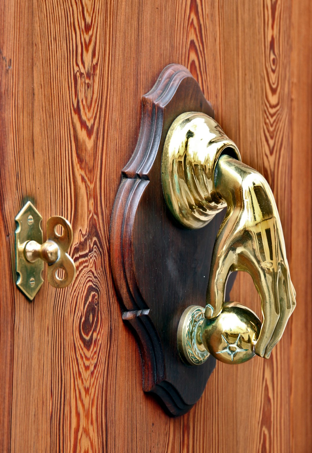 Golden door handle on an old door, Mallorca, Spain, May 2018